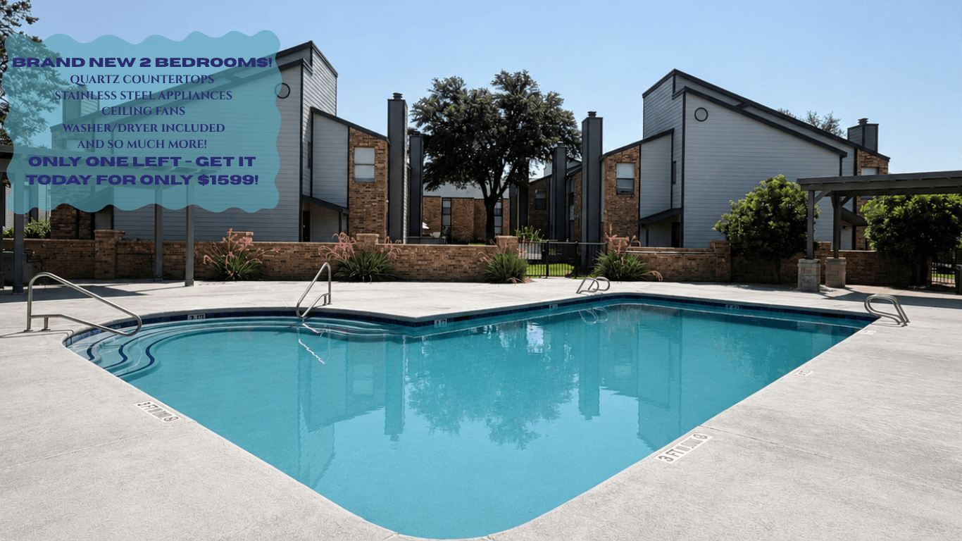A pool in front of a building with a sign advertising a sale.